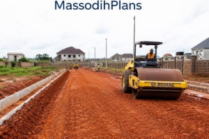 Nigerian estate road construction showing laterite base preparation and drainage channels